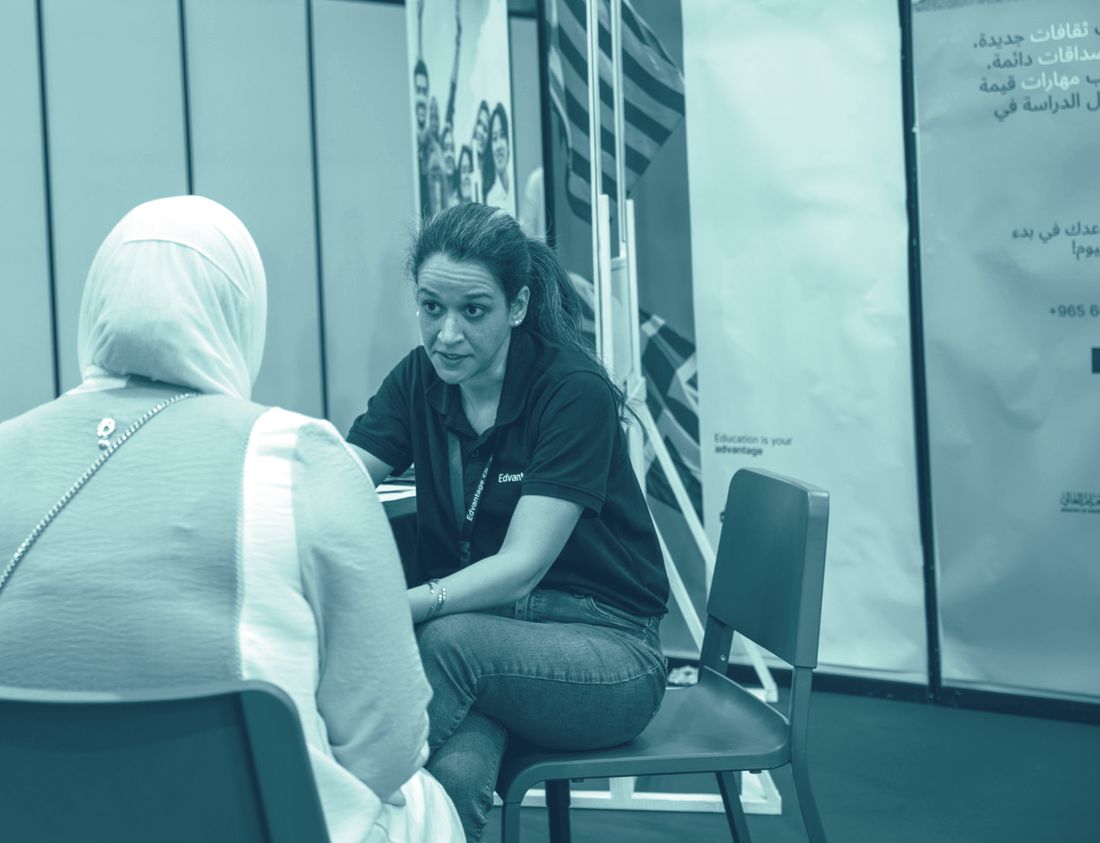 An Edvantage advisor in a one-to-one consultation with a visitor